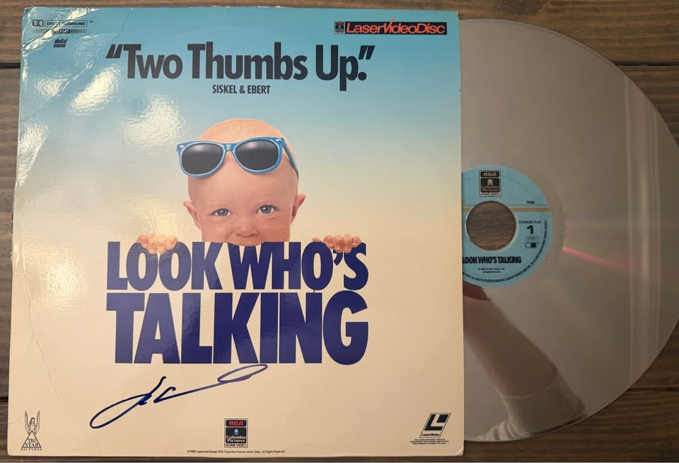 🎬 John Travolta Autographed “Look Who’s Talking” LaserDisc Album – Beckett Certified