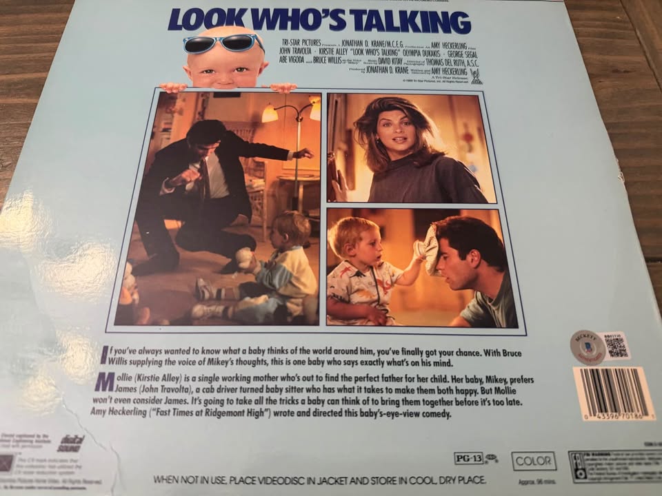 🎬 John Travolta Autographed “Look Who’s Talking” LaserDisc Album – Beckett Certified