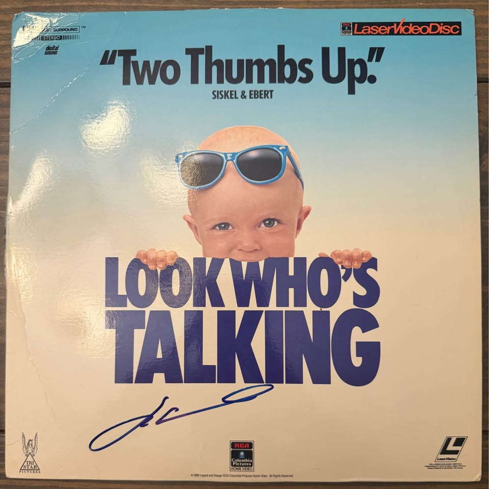 🎬 John Travolta Autographed “Look Who’s Talking” LaserDisc Album – Beckett Certified