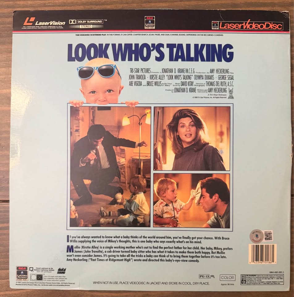 🎬 John Travolta Autographed “Look Who’s Talking” LaserDisc Album – Beckett Certified
